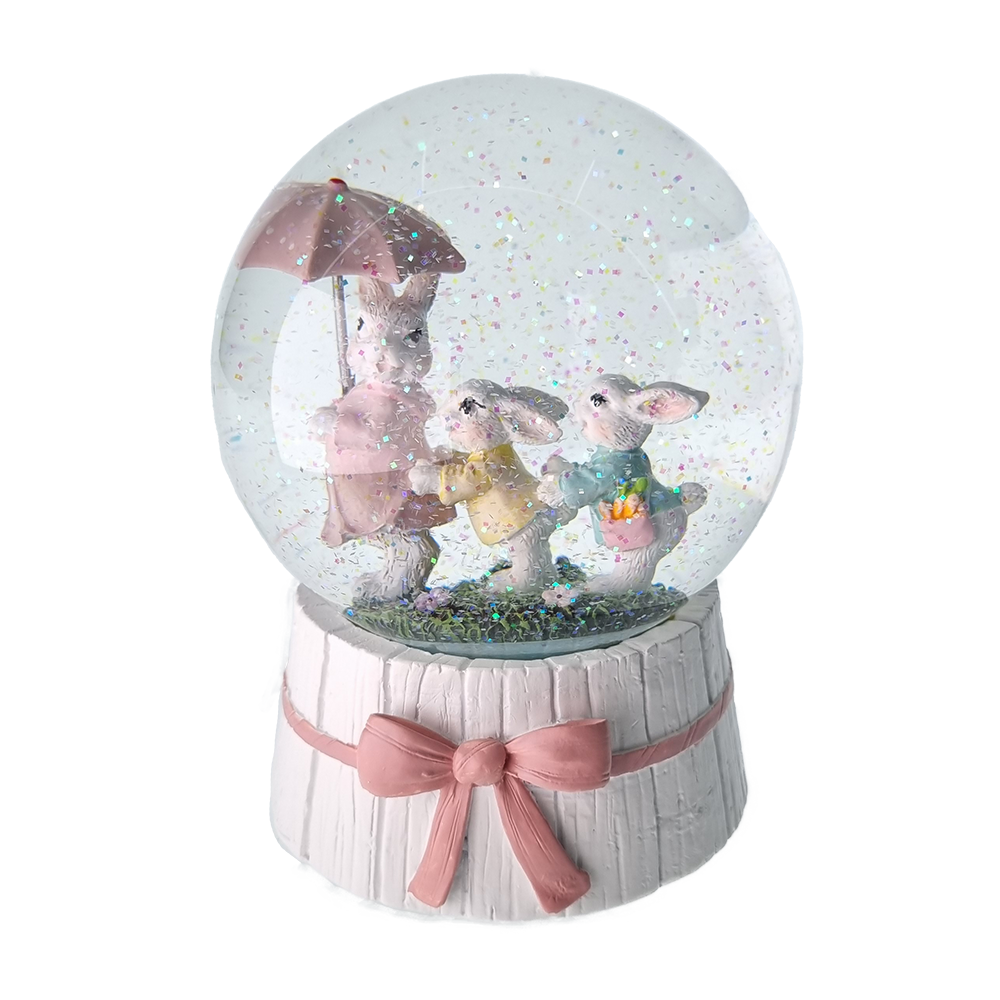 Viv! Christmas Pasen Sneeuwbol incl. muziekdoos - Drie paashaasjes met paraplu - roze wit - 16 cm hoog - Pasen
